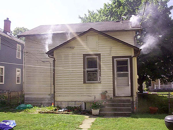 Illegal downspout hookup revealed by Superior Smoke